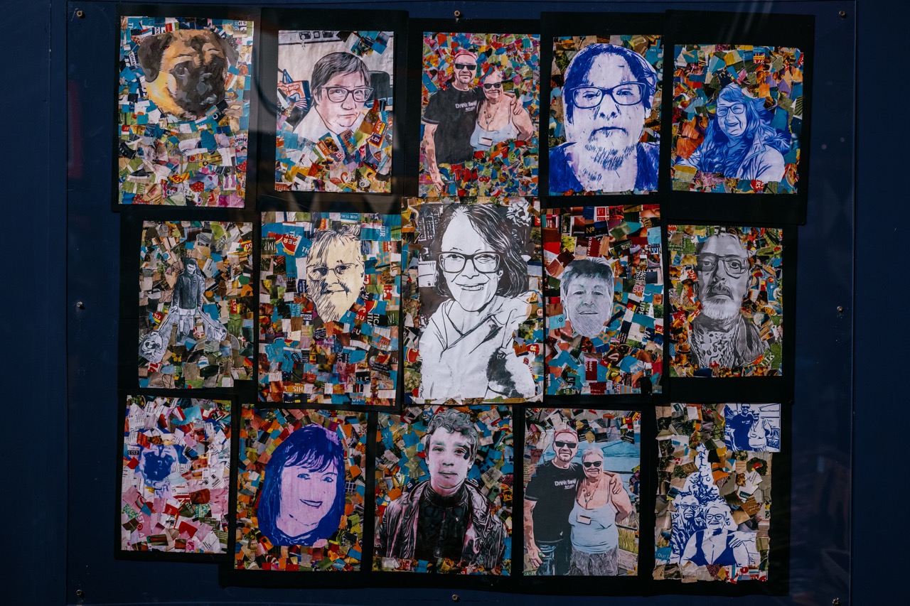 A collage of 14 portraits, some in colour and some in blue and white, arranged in a grid over a multicoloured, mosaic-style background. The portraits depict different people, each with unique facial expressions.