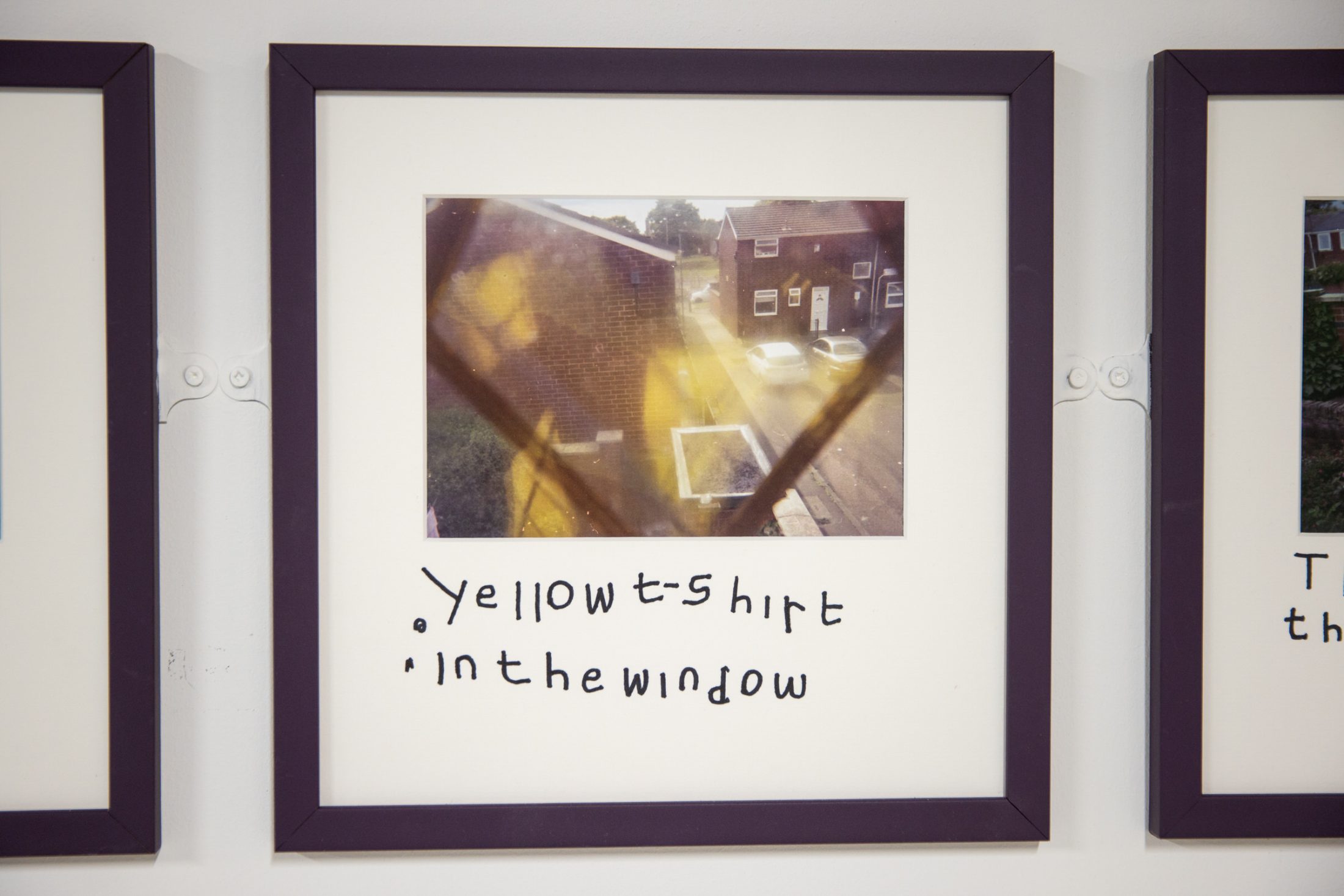 Framed photo with handwritten text reads 