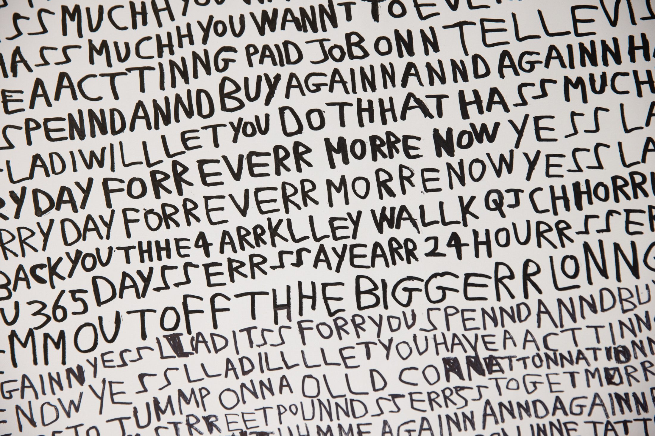 Handwritten black text in various sizes and angles fills a white background, repeating phrases like BUY AGAIN, PAY DAY FOREVER, and TELL EVERYONE. The words overlap and are closely spaced, creating a chaotic effect.