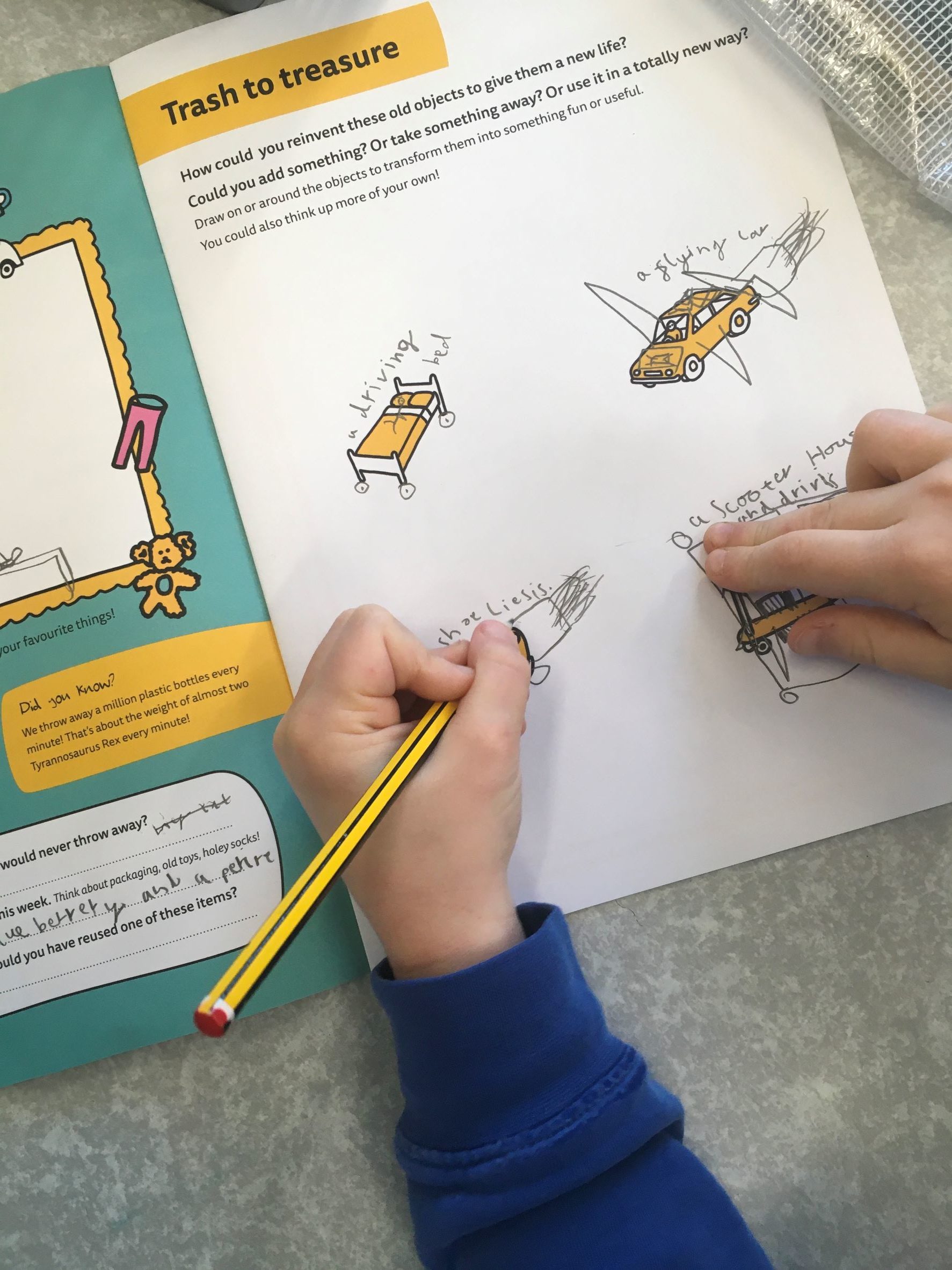 A child draws on a worksheet titled Rubbish to treasure, sketching ideas for reusing objects. The page shows drawings of a shopping trolley, a toy car, and other items with handwritten notes.
