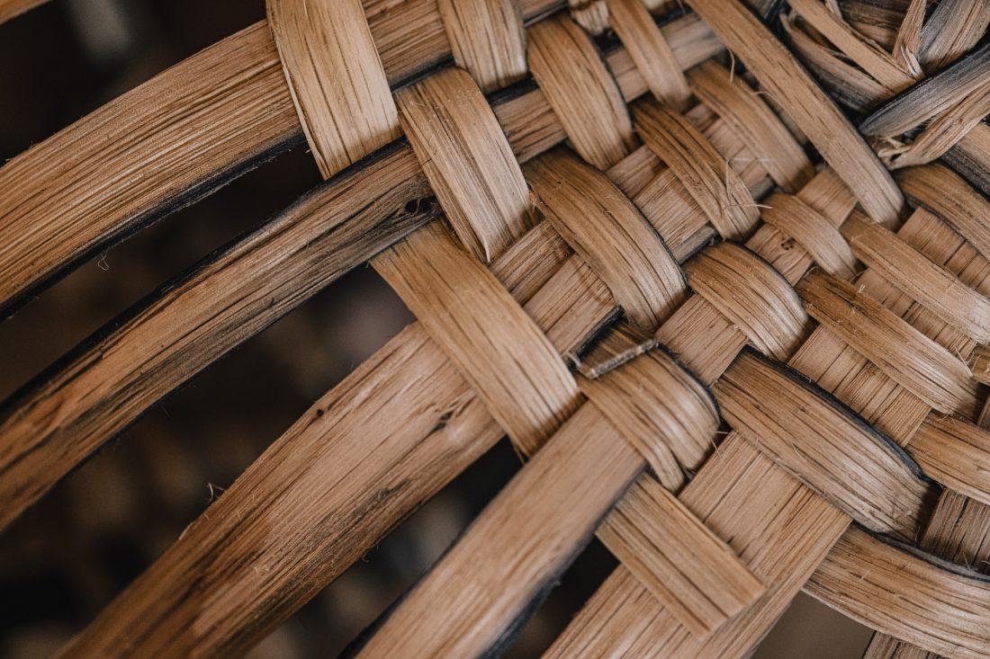Close-up of woven bamboo texture in a detailed pattern.